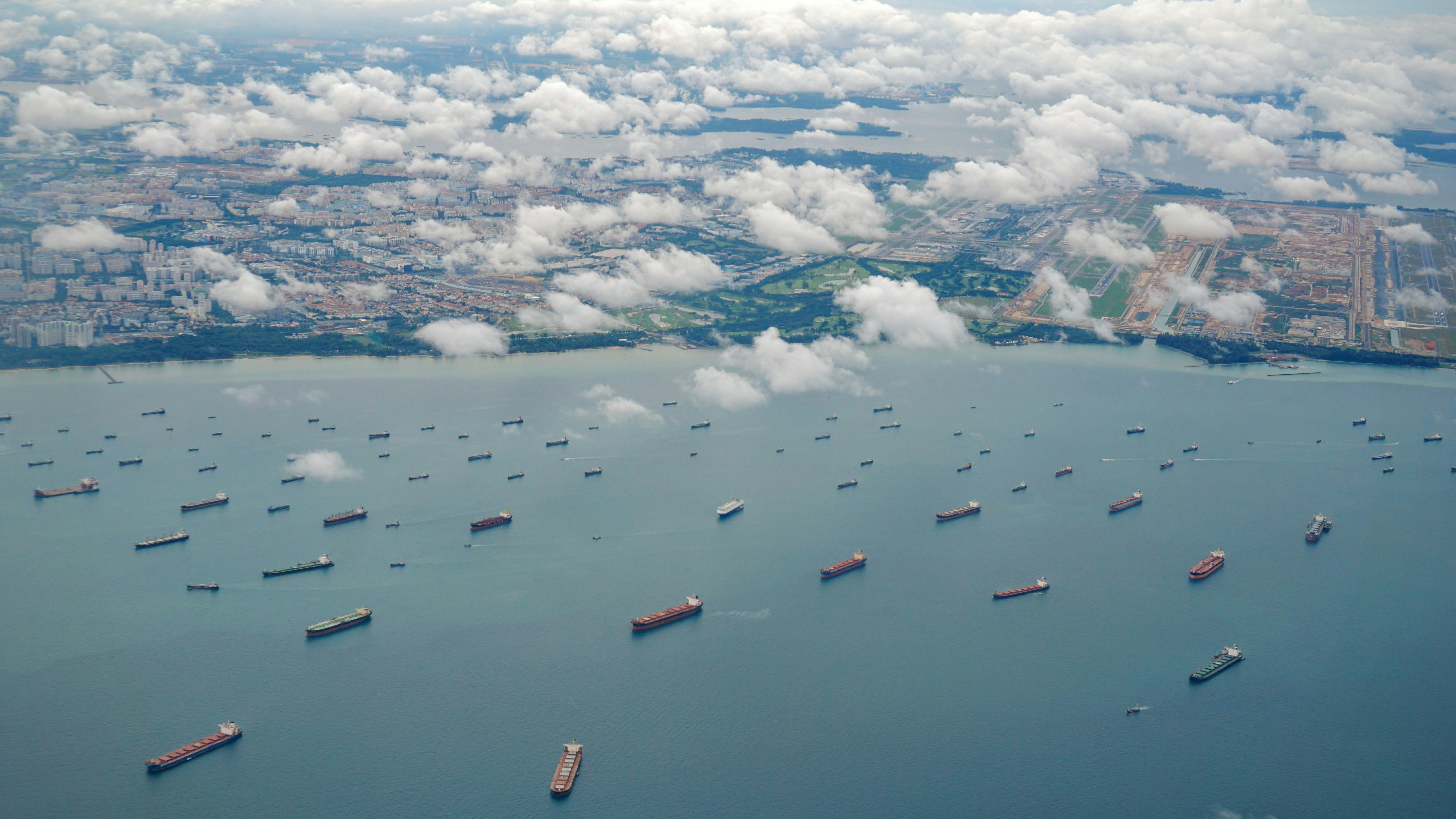 Aerial view of Singapore harbour with cargo vessels